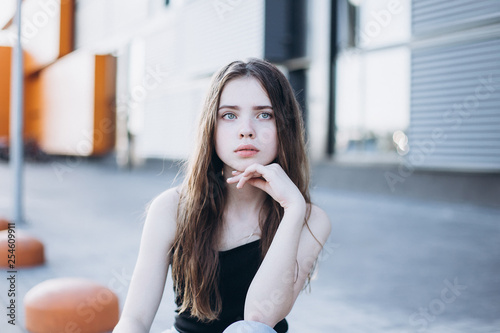 Cute cheerful portrait of young teenage girl outdoors in the street . Emotions, portrait, beauty concept © Andreshkova Nastya