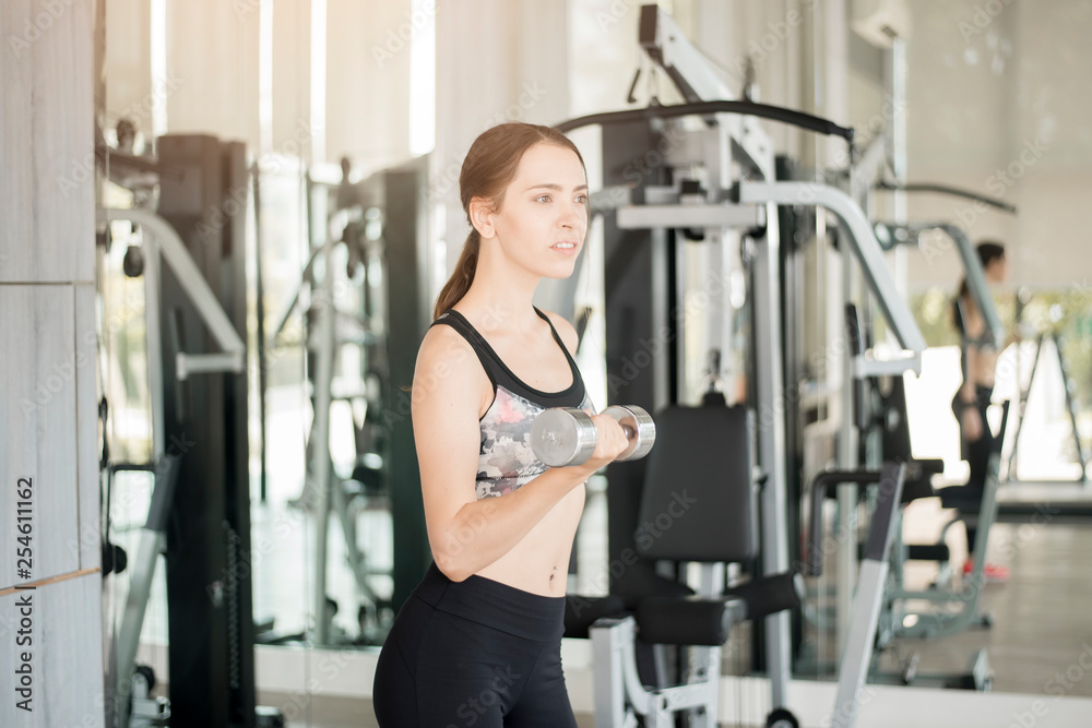 Pretty young sport woman is Workout in gym, Healthy lifestyle Pretty young sport woman is Workout in gym, Healthy lifestyle