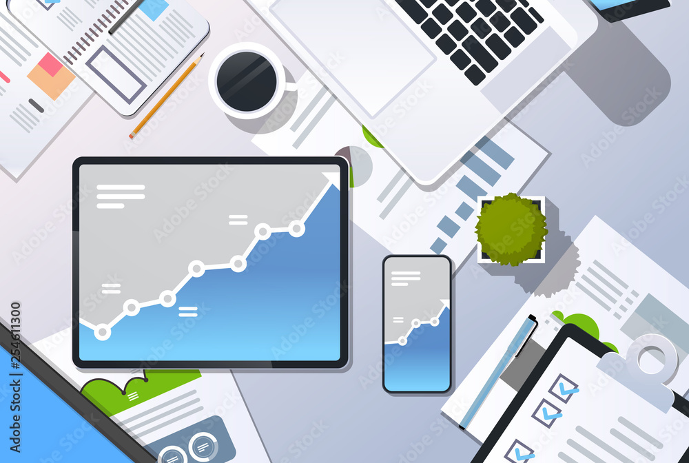 Fototapeta premium analysis financial graph finance business chart growth concept top angle view desktop laptop smartphone tablet screen paper report office stuff horizontal