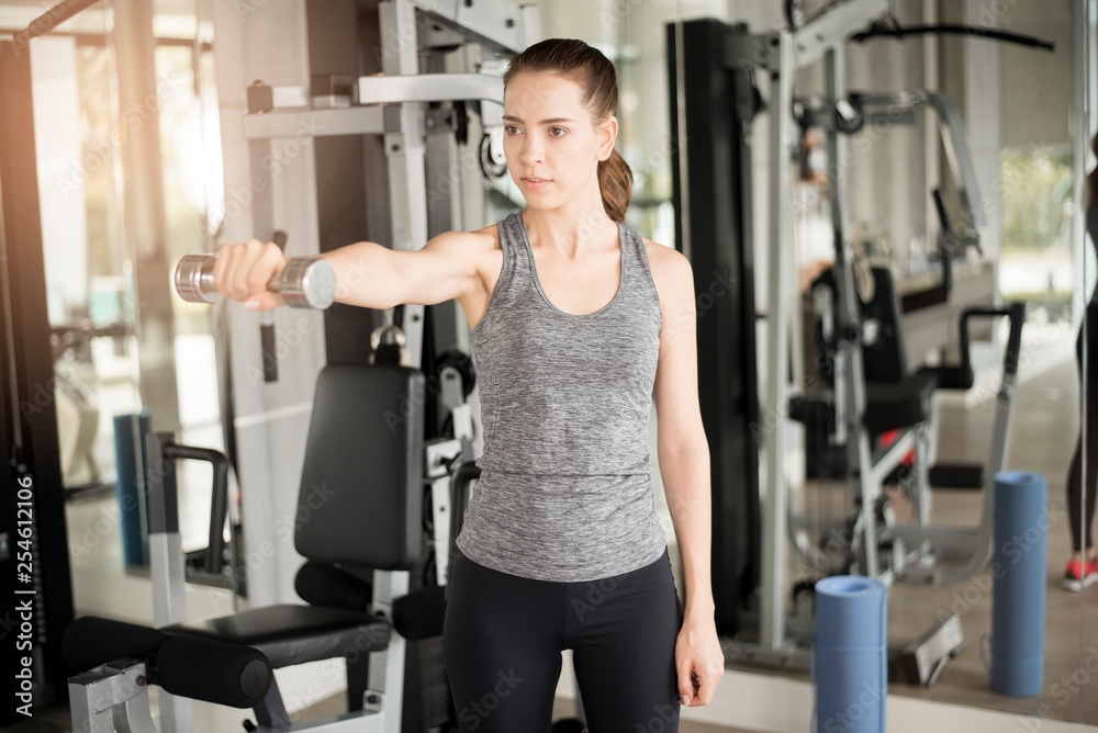 Pretty young sport woman is Workout in gym, Healthy lifestyle Pretty young sport woman is Workout in gym, Healthy lifestyle