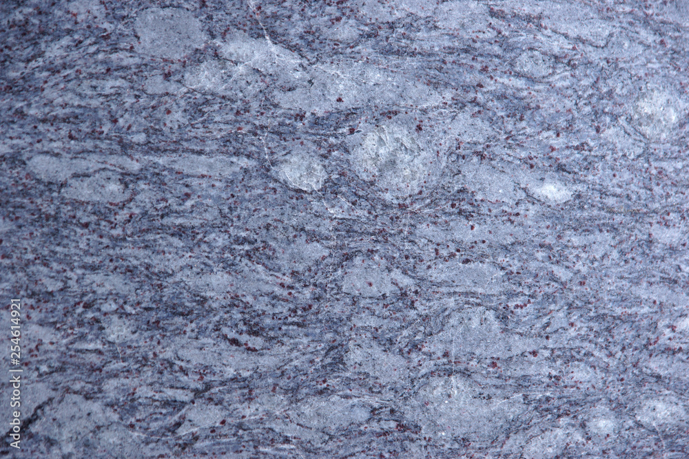 Naklejka premium Granite gray-blue with specks, natural stone for interior work, called Orisa Blue