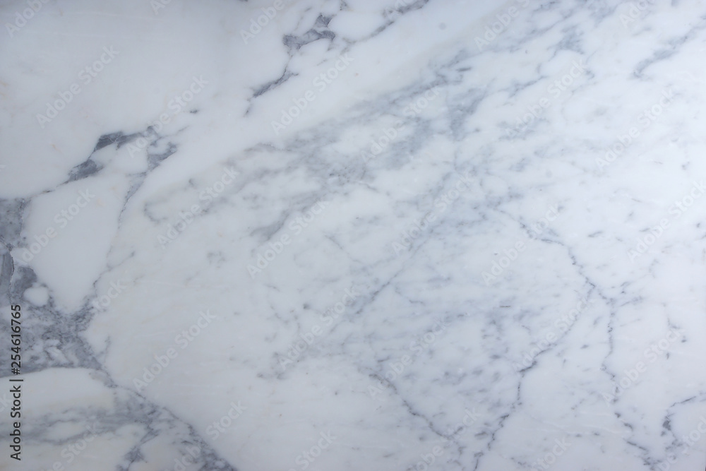 A background of white marble with gray streaks is called Arabescato