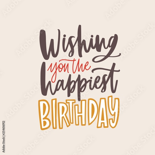 Banner template with Wishing You The Happiest Birthday phrase handwritten with elegant calligraphic cursive font on light background