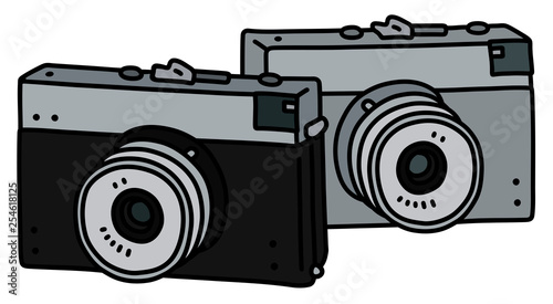 The vector drawing of two retro photographic cameras