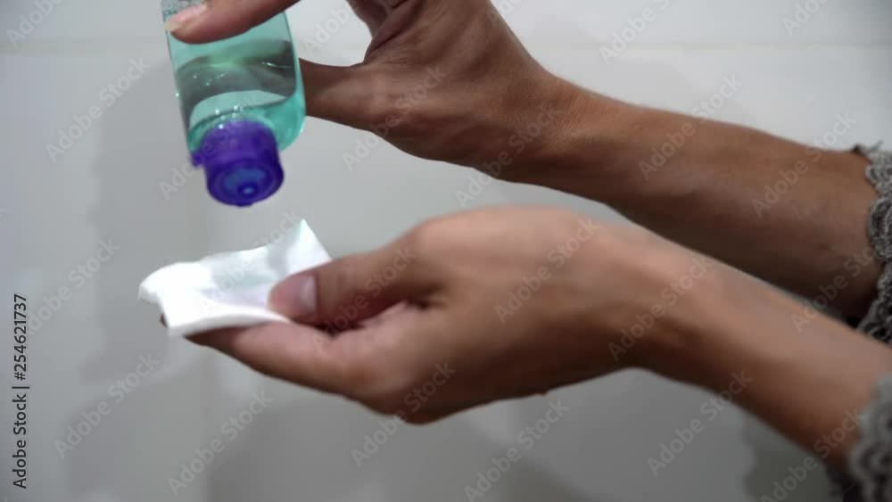 Girl Holding Cotton Pad And Bottle Of Water. Girl Holding Cotton Pad And Bottle Of Water.