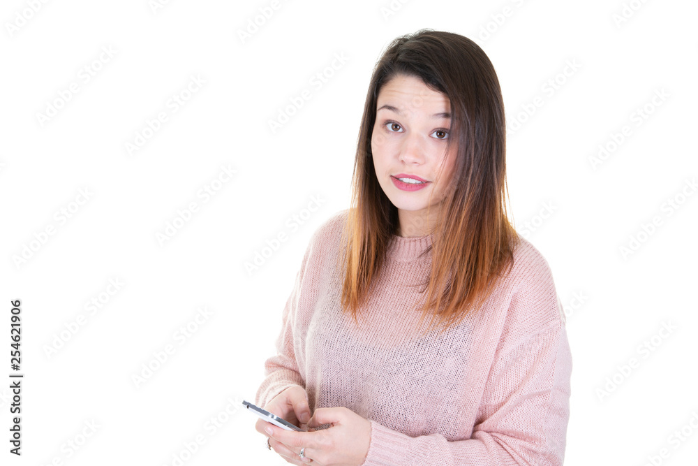 Beautiful young woman checking email via mobile phone white background with copy space for text Beautiful young woman checking email via mobile phone white background with copy space for text