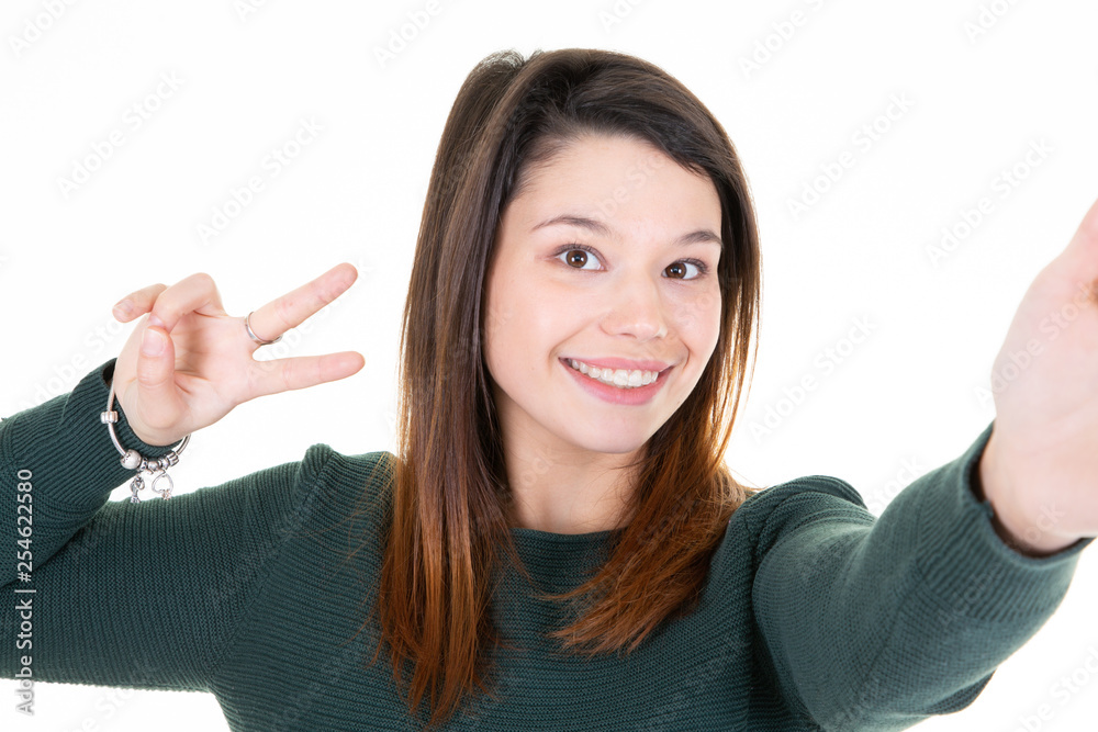 peace sign pretty young woman making selfie on white background peace sign pretty young woman making selfie on white background