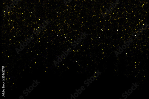 Glitter dust overlay, abstract background, shiny light gold glitter bokeh