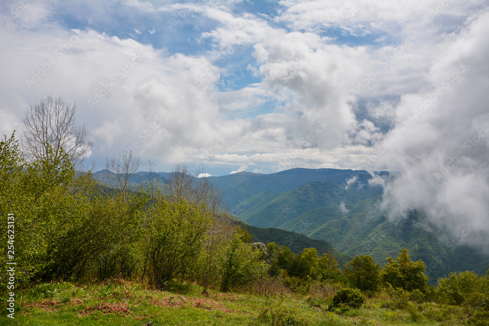 Spring landscape in Rhodope mountain, Bulgaria rainy puffy clouds Spring landscape in Rhodope mountain, Bulgaria rainy puffy clouds