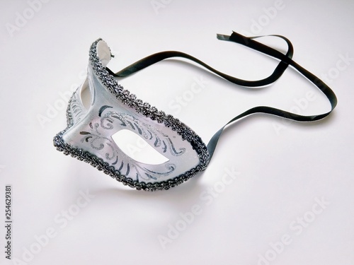 beautiful carnival silver mask with patterns on white background