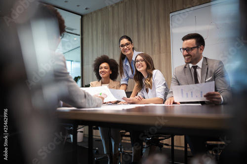 Group of successful business people at work in office