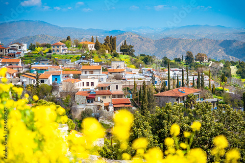 Amazing view of famous landmark tourist destination valley Pano Lefkara village, Larnaca, Cyprus known by ceramic tiled house roofs and Greek orthodox church photo
