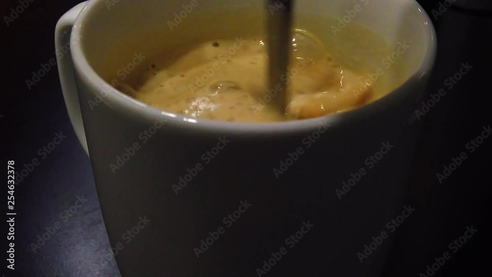 Slow motion of stirring a coffee with a spoon fast. Slow motion of stirring a coffee with a spoon fast.