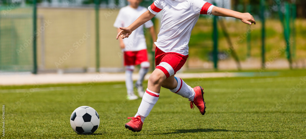 Soccer Shot. Young Boys Kicking Football Soccer Tournament Match on the Grass Pitch. Football Players Duel. Running Soccer Players from Youth School Soccer Teams