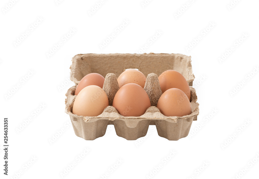 Fresh brown eggs in carton on isolated
