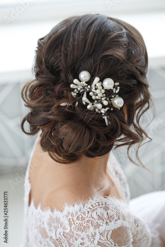Wedding hairstyle with exquisite decoration from the back.