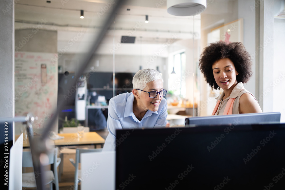 Programmers cooperating at IT company developing apps Programmers cooperating at IT company developing apps