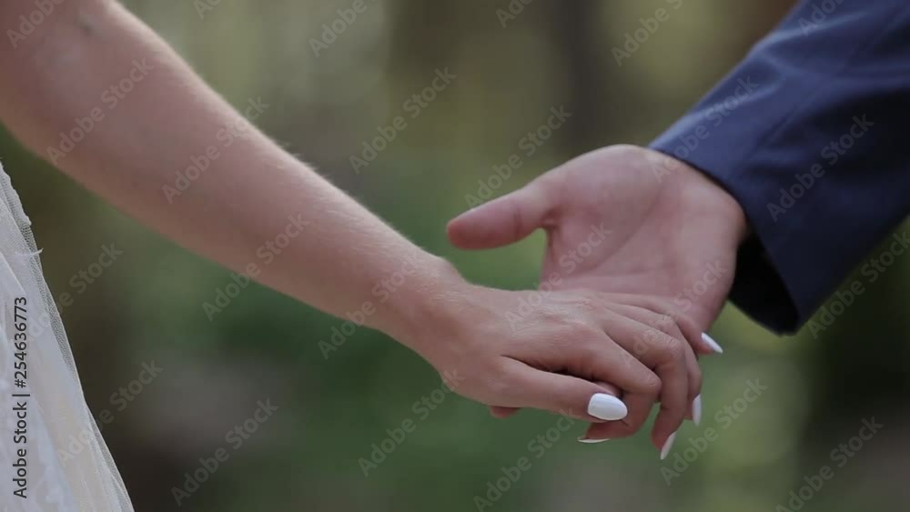 Marry Me Today And Everyday. Newlywed Couple Holding Hands, Shot In Slow Motion. Marry Me Today And Everyday. Newlywed Couple Holding Hands, Shot In Slow Motion.