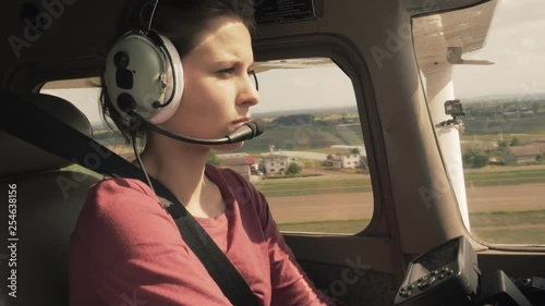 Small private plane approach to landing in a farmland area cabin view photo