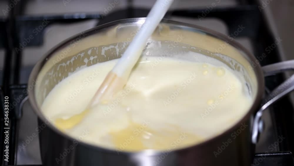 Custard cream in pan. Cooking cream. Custard cream in pan. Cooking cream.