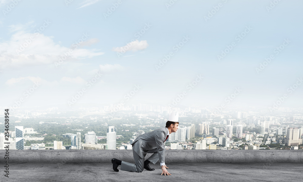 King businessman in elegant suit running on building roof and business center at background King businessman in elegant suit running on building roof and business center at background