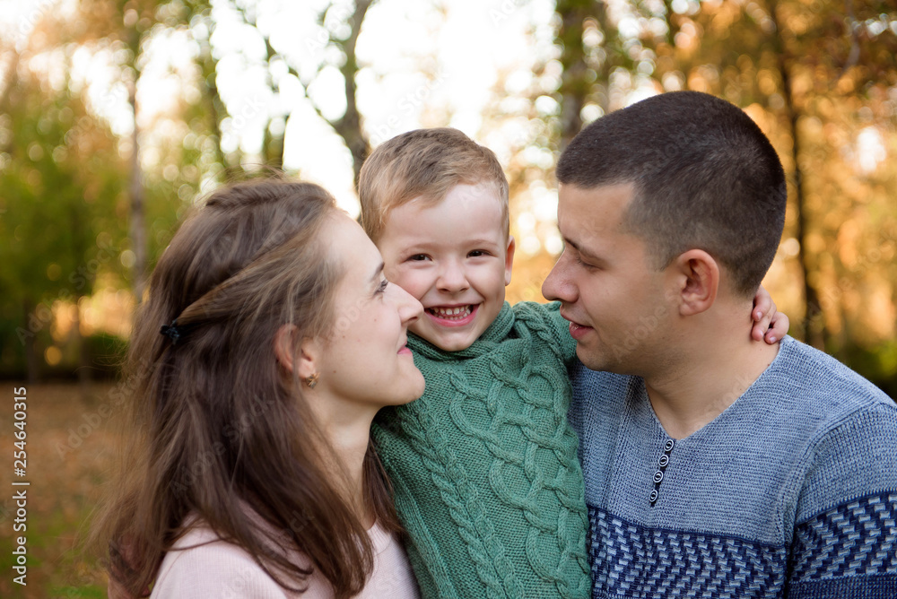 Happy family resting in beautiful autumn park Happy family resting in beautiful autumn park