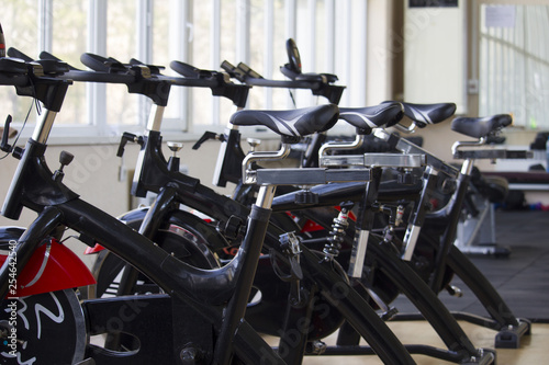 Row of training exercise bikes detail. Healthy lifestyle concept 