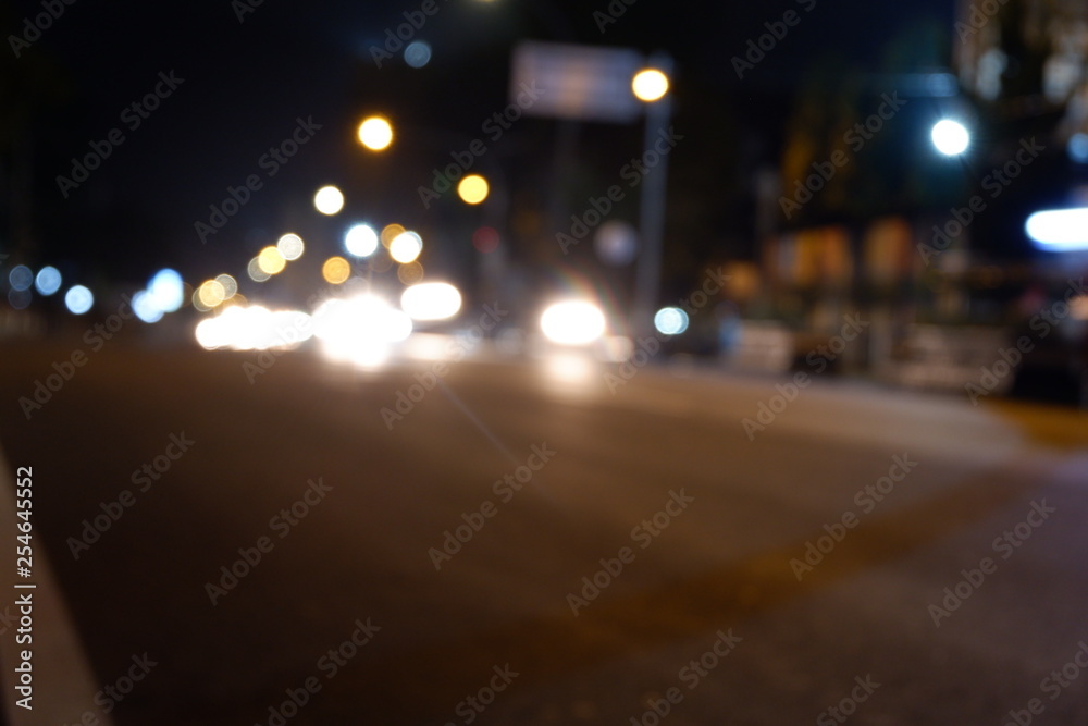 Artistic style dark defocused and blured lights of night in the city