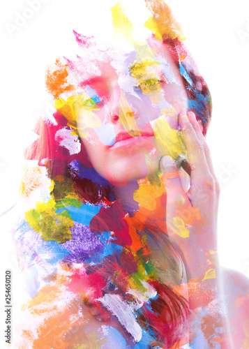Paintography. Double exposure. Close up of an attractive peaceful model combined with colorful hand drawn acryllic paintings with overlapping brushstroke texture