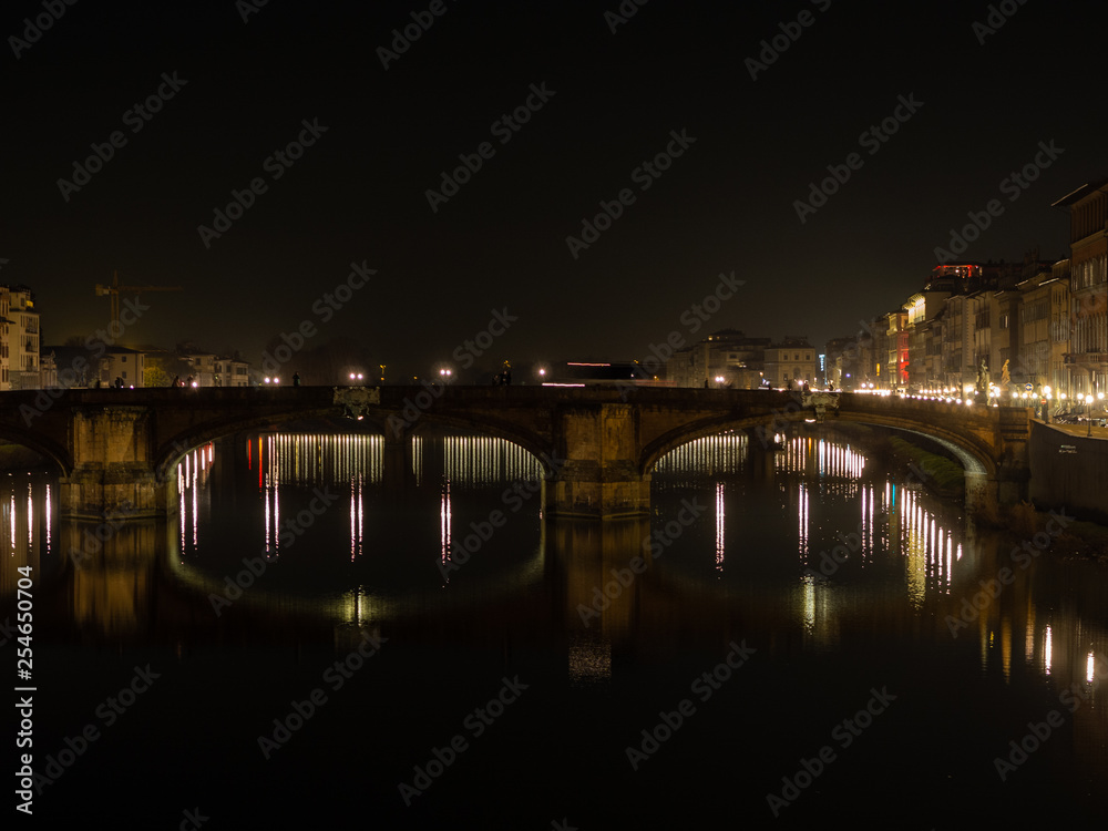 Florence and the Arno river at night