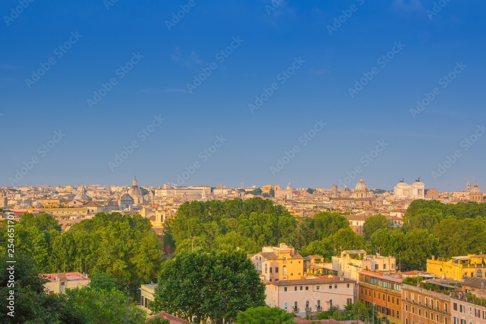 Beautiful view of Rome, Italy. Sunny summer evening. Aerial panoramic cityscape of Rome. Rome skyline with the dome of Saint Agnese Church, the Campidoglio and the Altare della Patria monument.