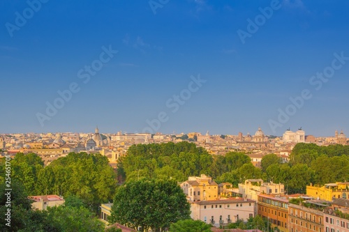 Beautiful view of Rome, Italy. Sunny summer evening. Aerial panoramic cityscape of Rome. Rome skyline with the dome of Saint Agnese Church, the Campidoglio and the Altare della Patria monument.