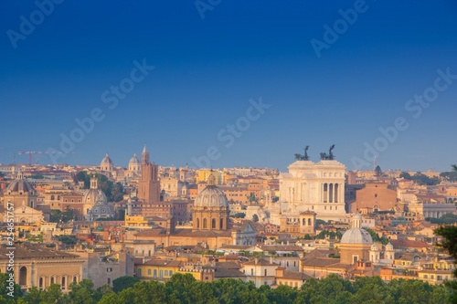 Beautiful view of Rome  Italy. Sunny summer evening. Aerial panoramic cityscape of Rome. Rome skyline with the dome of Saint Agnese Church  the Campidoglio and the Altare della Patria monument.