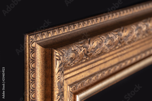 Classic frame for paintings with stucco on a black background