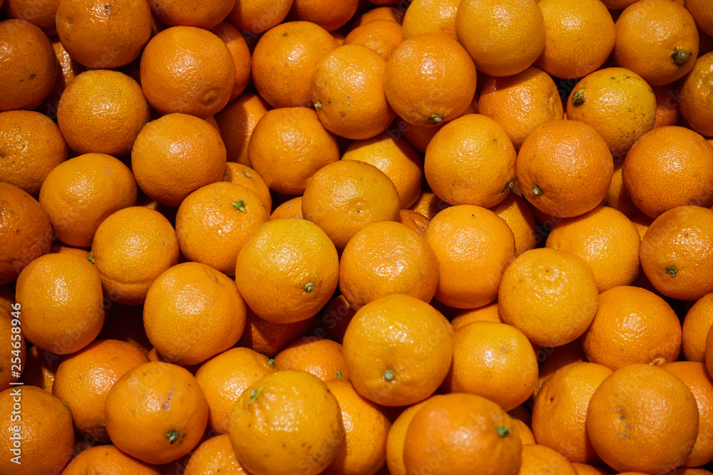Fresh mandarin oranges texture. Background with close-up shooting