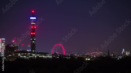 A night view of the London skyline from Primrose Hill showing the BT tower and the London Eye. photo