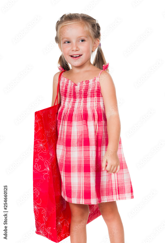 Cute litle girl with red shopping bag isolated on a white background Cute litle girl with red shopping bag isolated on a white background