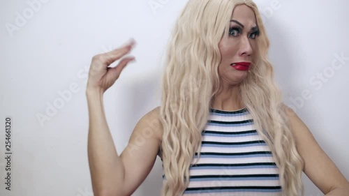 Close-up shot of a beautiful transgender woman doing a too much talking hand gesture