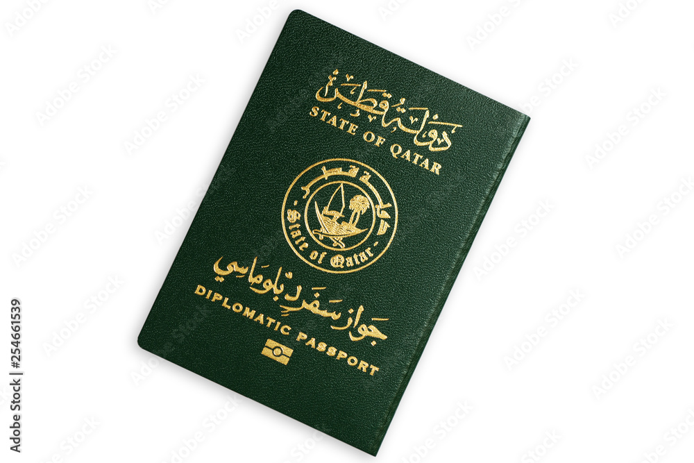 Green diplomatic biometric passport of the State of Qatar isolated on white background