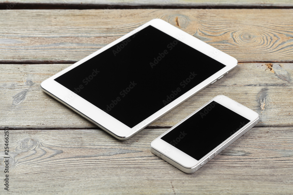 digital tablet and smartphone on the table digital tablet and smartphone on the table
