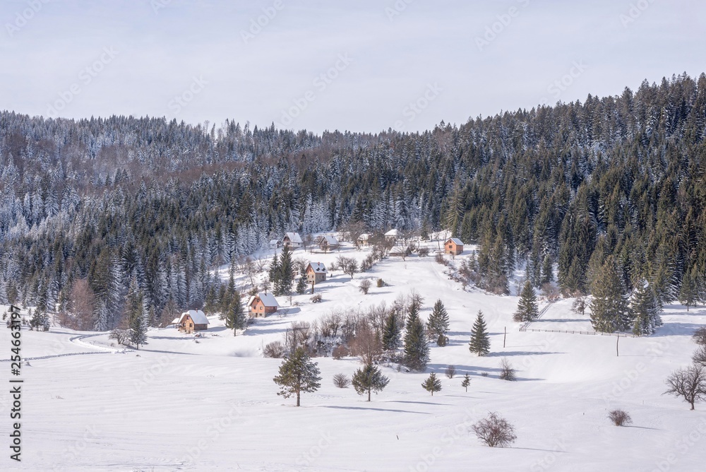 rural mountain village houses. snow mountain landscape with local houses.