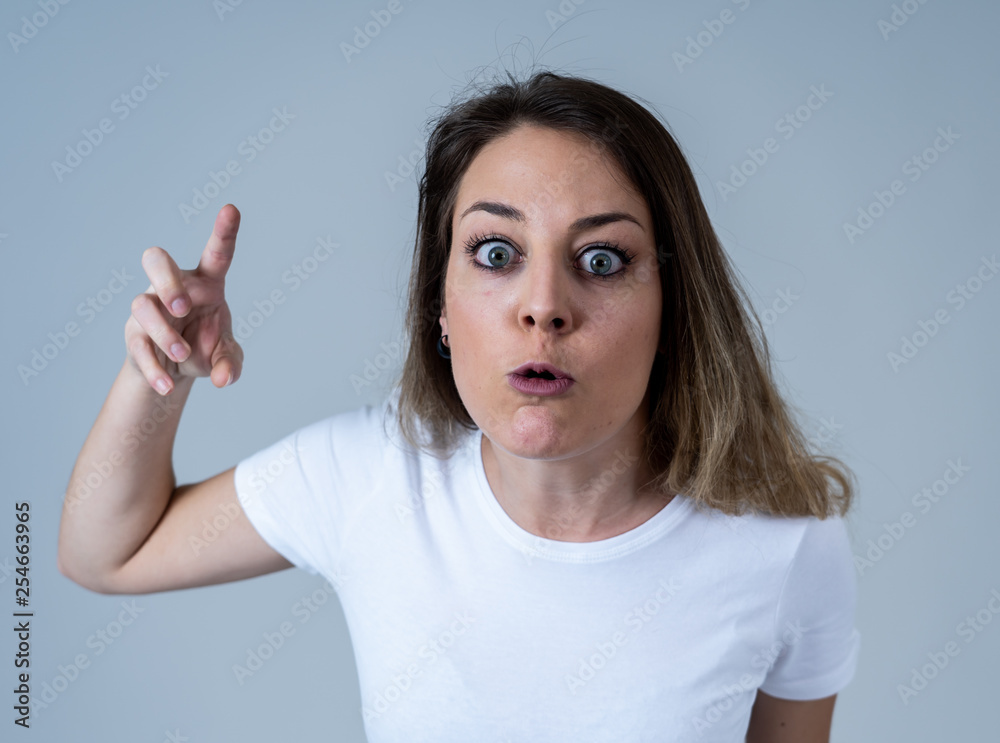 Human expressions and emotions. Desperate young attractive woman with angry face looking furious
