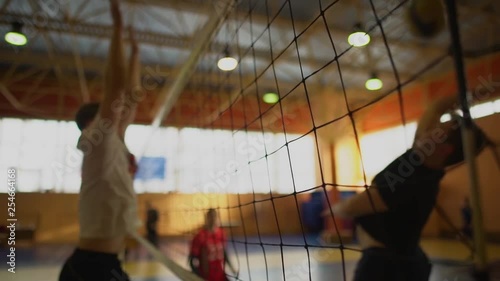 High School Volleyball Match In Gymnasium