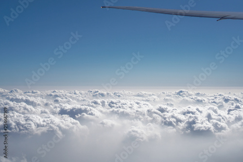 View in the illuminator box during the flight. Travel by airliner with a beautiful cloud landscape. Stock photos