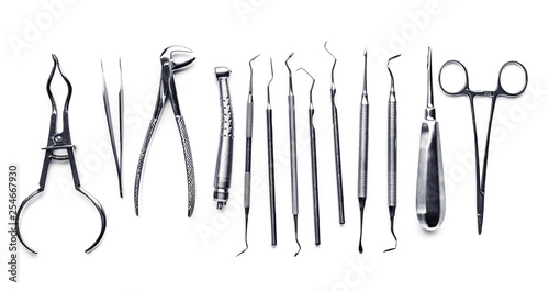 Different shiny metal medical tools isolated on white background
