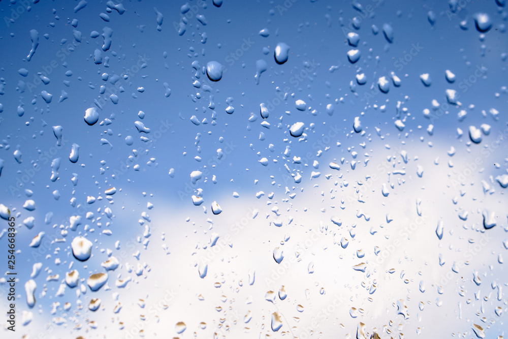 Beautiful raindrops on the window glass. Spring summer weather with warm rain. Stock photo Beautiful raindrops on the window glass. Spring summer weather with warm rain. Stock photo