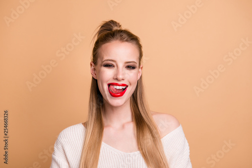 Close-up portrait of her she nice-looking lovely fascinating attractive glamorous cheerful straight-haired girl enjoying licking lips isolated on beige pastel background