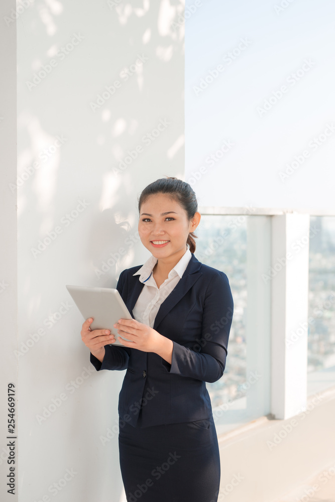 Portrait of smiling business woman using tablet pc Portrait of smiling business woman using tablet pc