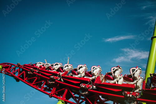People ride the roller coaster. Climb to the top without seeing the ground
