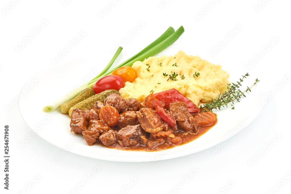 Beef stew, traditional homemade European meat goulash, Hungarian bograch, close-up, isolated on white background
